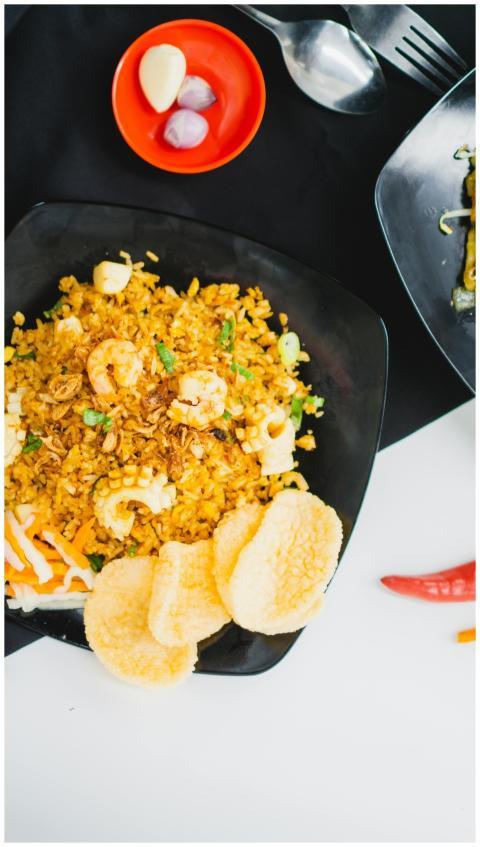 Tasty plate of Indonesian fried rice with prawns a
