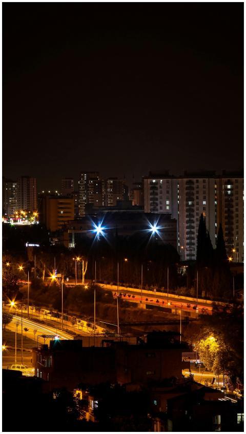 A vibrant cityscape at night showcasing brightly l