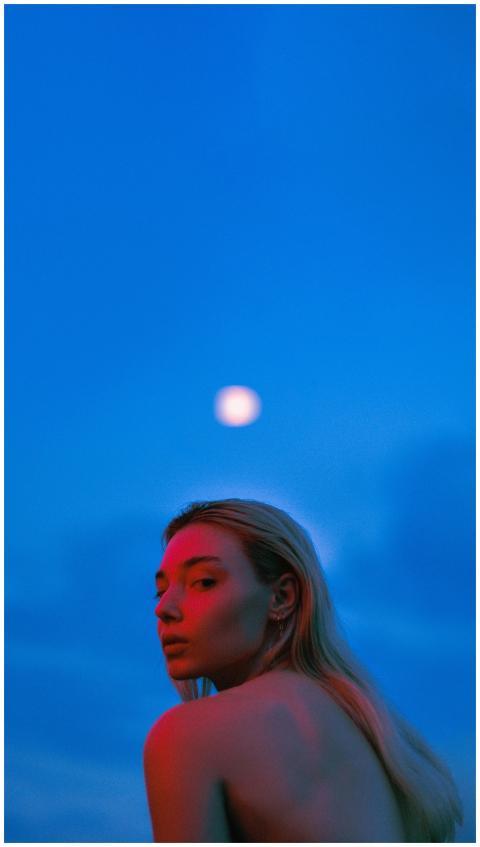 Captivating image of a woman with colorful lightin