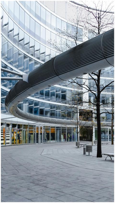 Contemporary building design featuring curved faca