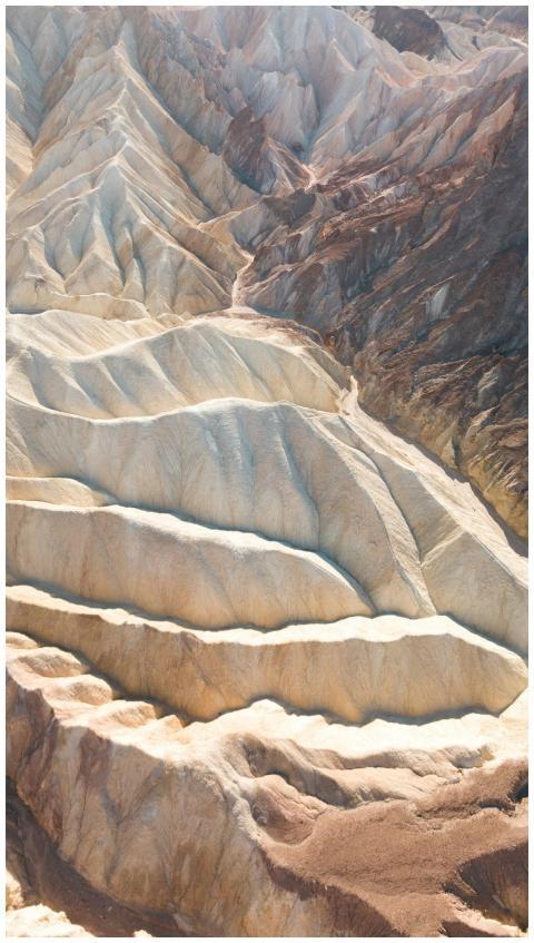 Explore striking eroded cliffs in a sunlit desert