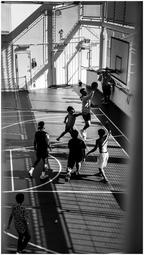 High-energy basketball game on an outdoor court in