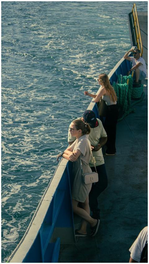 Passengers enjoying a leisurely ferry ride on a su