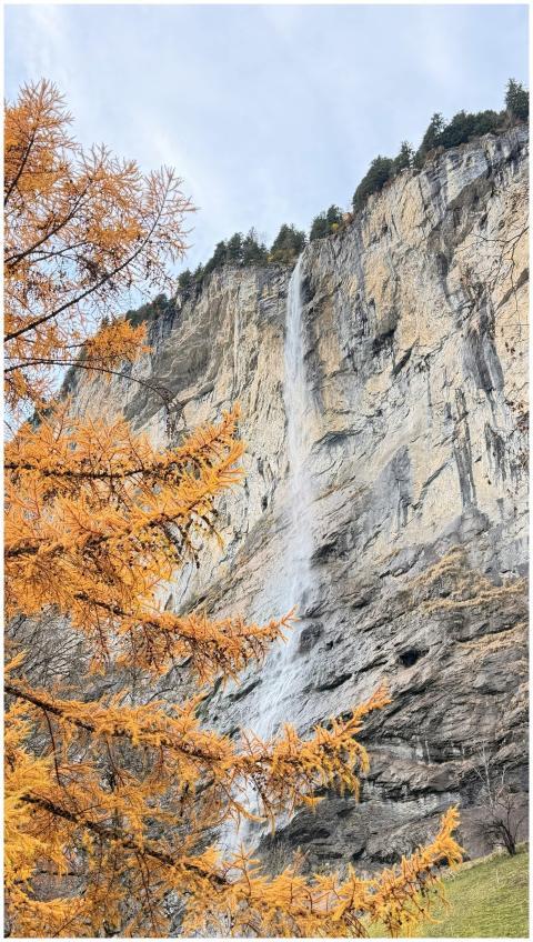 Majestic waterfall cascading down cliffs in Lauter