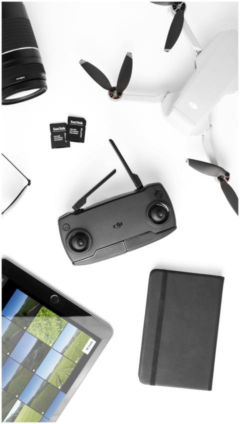 Flat lay of drone technology gadgets including con