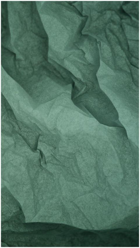 Abstract green crumpled paper texture, ideal for b