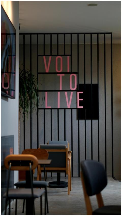 Contemporary cafe interior with chairs and decor,