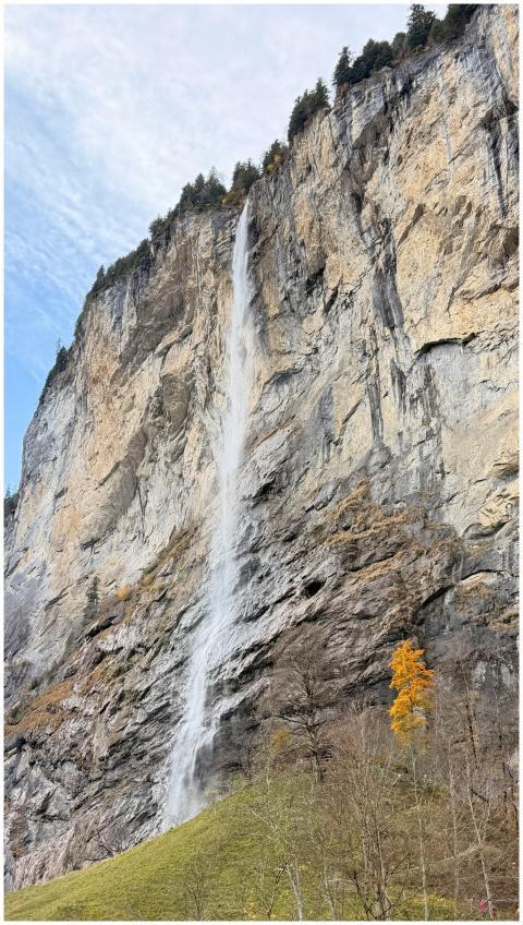 Scenic view of Staubbach Falls cascading down a cl