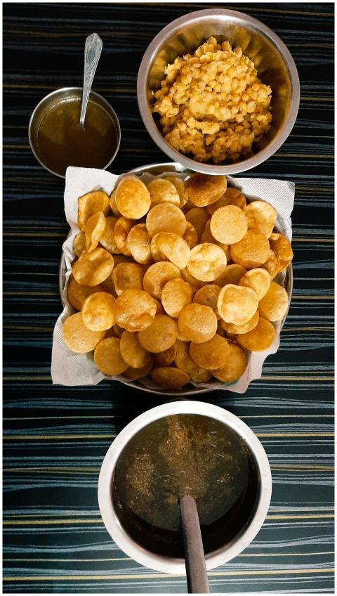 Top view of delicious Indian panipuri with condime