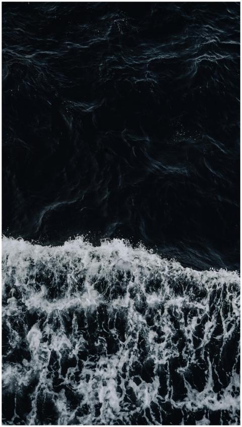A breathtaking aerial shot of powerful waves in a
