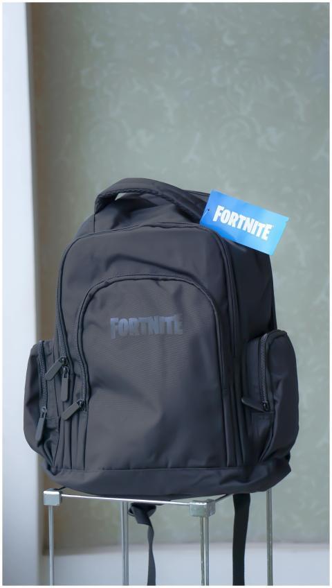 Sleek black backpack featuring Fortnite logo, perf