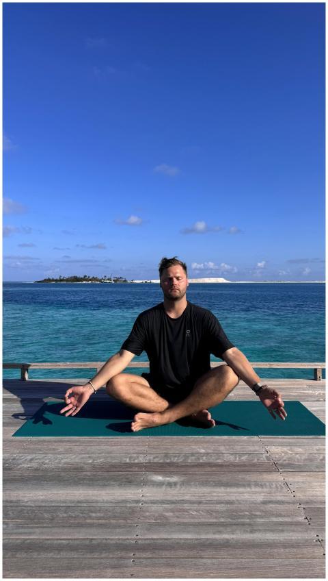 A serene yoga session by the ocean in the Maldives