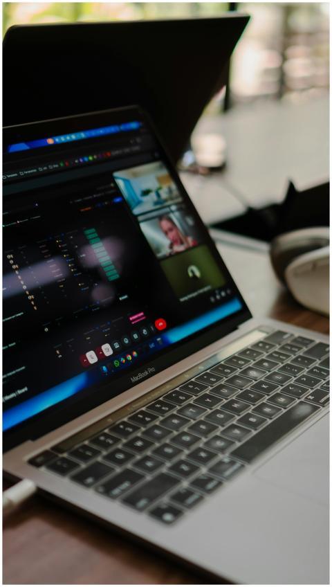 A laptop showing a video conference call, ideal fo