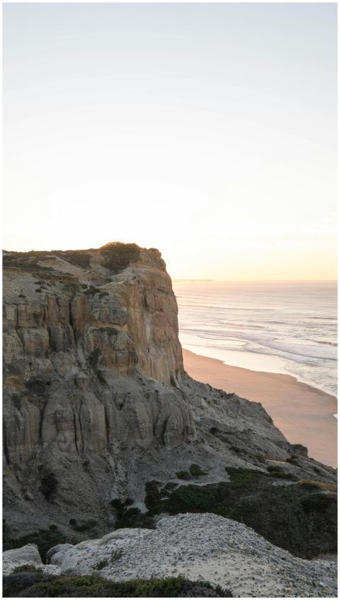 A stunning view of Nazaré's cliffs and beach durin