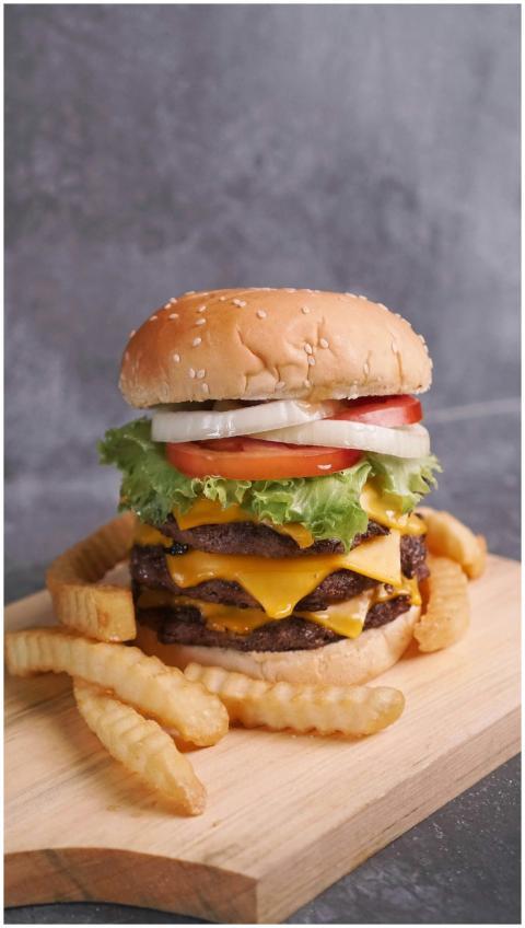 Mouthwatering double cheeseburger with fresh toppi