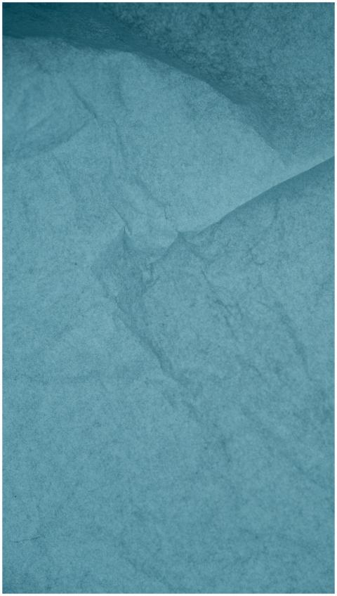 Crinkled blue paper texture suitable for backgroun