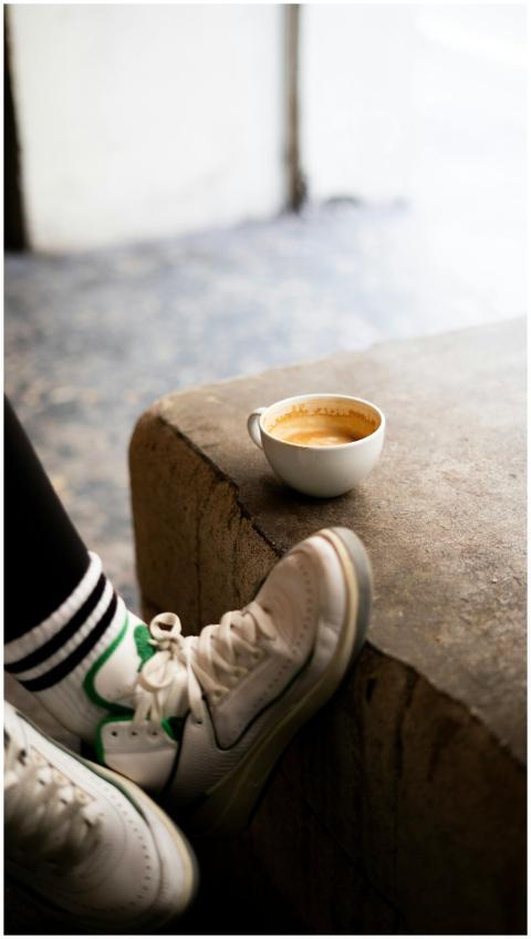 A cozy scene featuring a cup of coffee next to spo