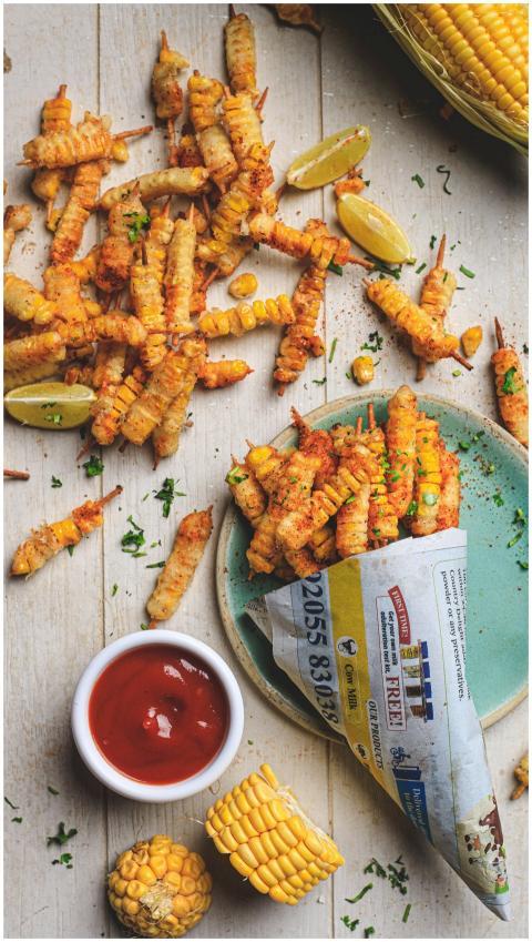 Delicious and crispy corn fries served with ketchu