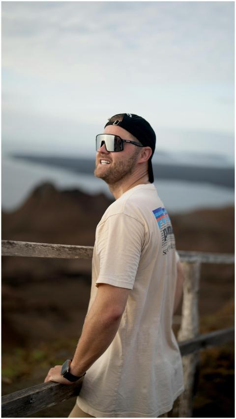 A man enjoys the scenic Galapagos landscape, showc