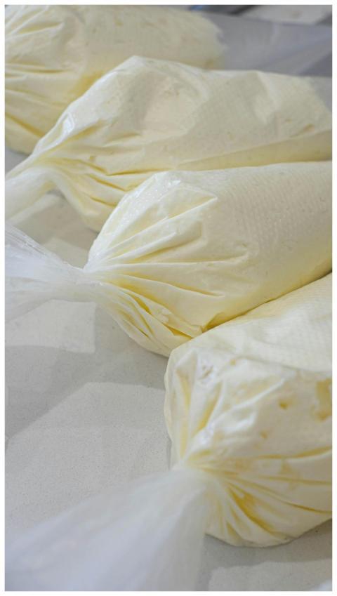 Close-up of pastry cream in piping bags, ideal for