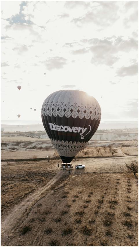 A hot air balloon floats over Cappadocia's unique