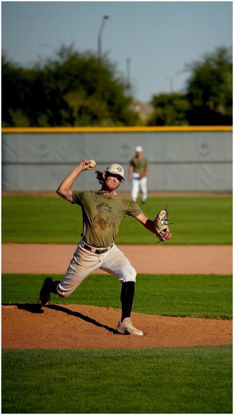 Dynamic action shot of a baseball pitcher in mid-t