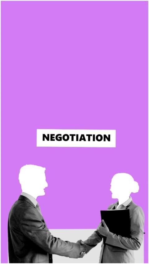 Business professionals shaking hands during negoti