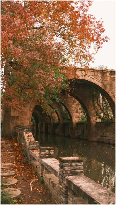 Picturesque historic stone bridge over a river wit