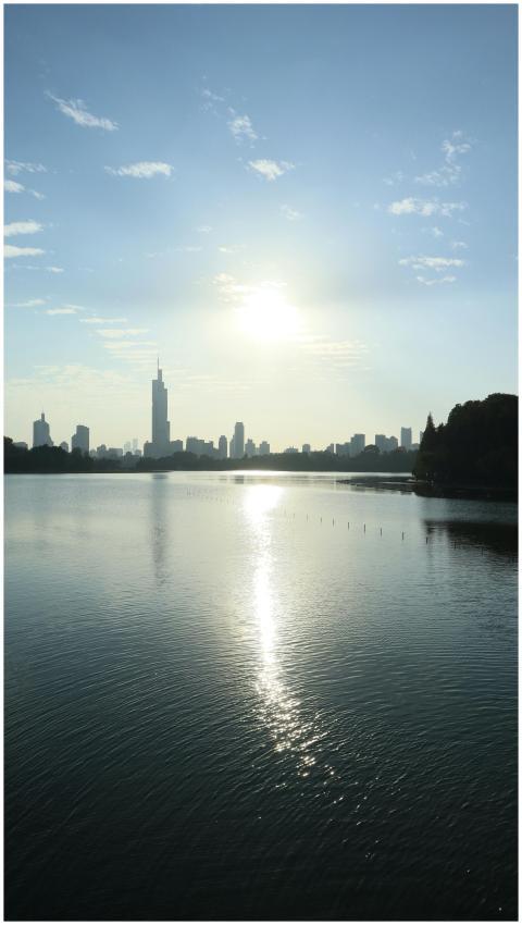 Breathtaking sunrise over a serene city skyline wi