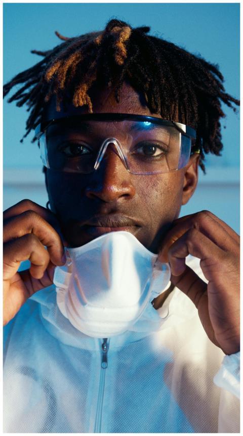 African American scientist confidently adjusting m