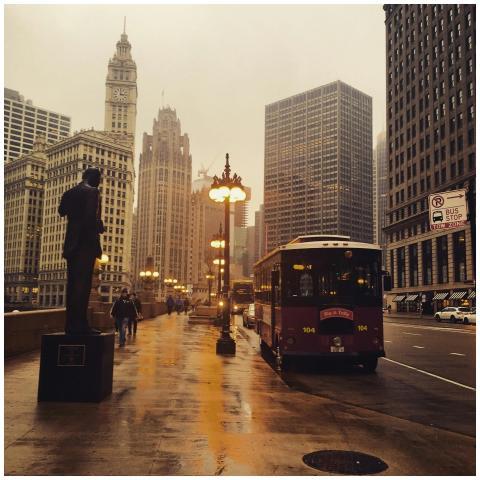 A rainy day scene in downtown Chicago featuring ur
