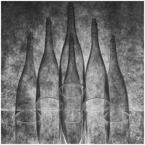 Abstract black and white image of bottles and glas