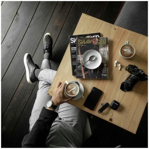 A top-down view of a caffeinated pause with magazi