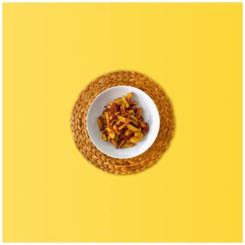 Delicious crispy fried potatoes in a bowl on a vib