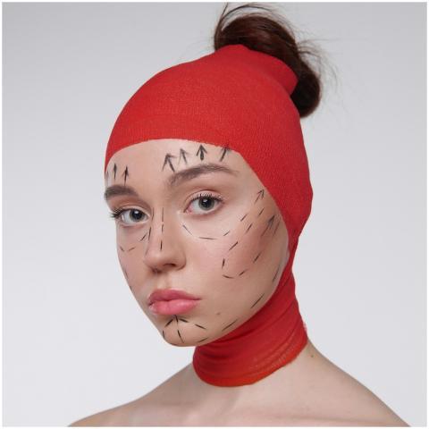 Portrait of a woman with surgery marks wearing a r