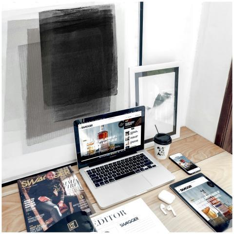 Stylish workspace with a laptop, smartphone, and m