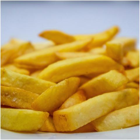 A mouthwatering close-up of crispy golden french f