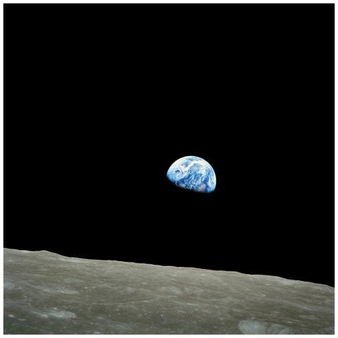 Iconic view of Earth rising over the lunar surface