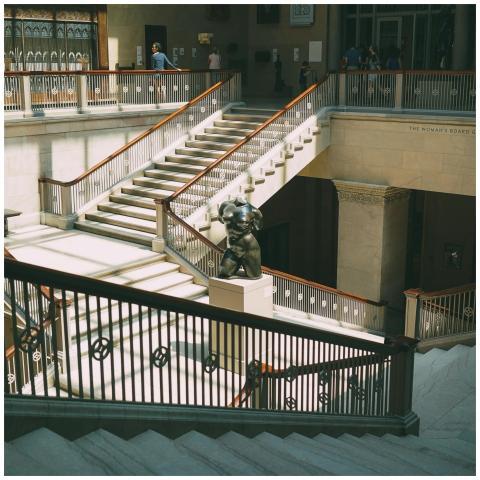 Elegant staircase in a Chicago museum with artisti