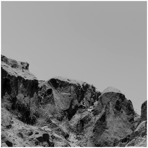 Scenic black and white rocks with heart carving in