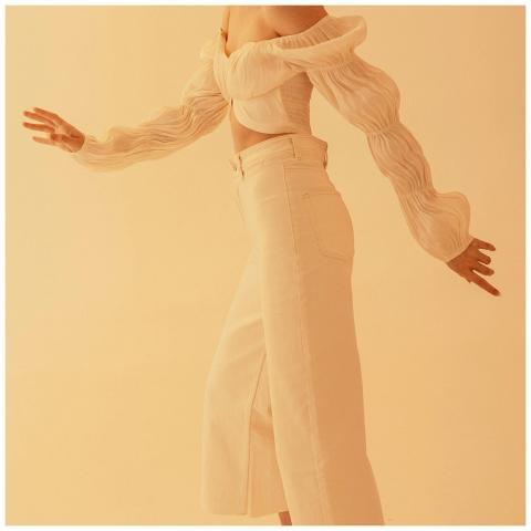 Elegant off-shoulder blouse paired with white pant