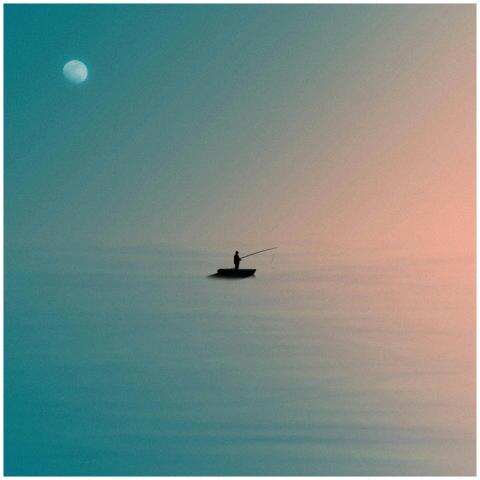 A lone fisherman silhouettes against a vivid, grad