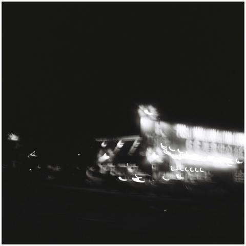 Blurred black and white photo of city lights at ni