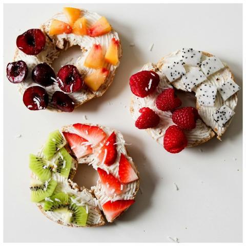 A delicious variety of cream cheese bagels topped