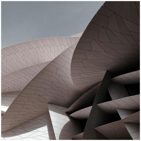 From below of high concrete building with metal co