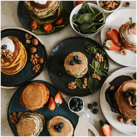 A tempting selection of pancakes with berries, nut