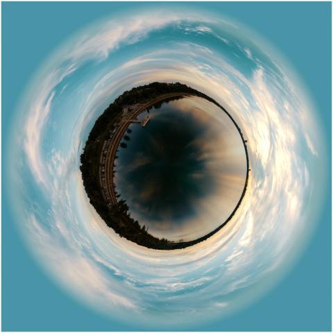 A stunning tiny planet view of a city skyline with