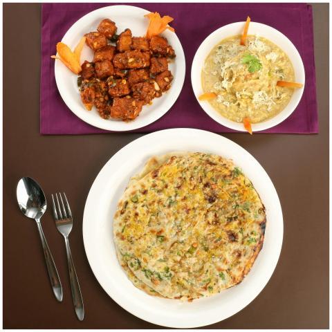 A top view of Indian dishes including an egg omele