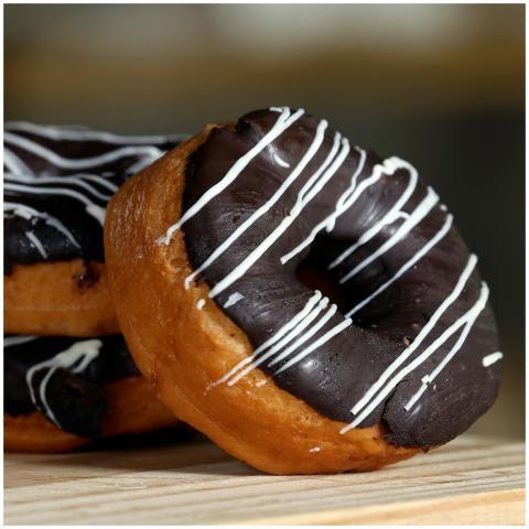 Close-up of delectable donuts topped with rich cho