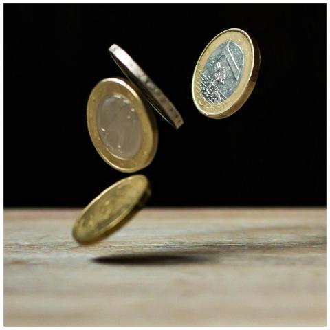 Dynamic shot of euro coins appearing to float, sym